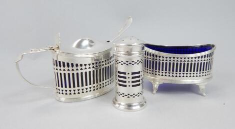 A matched George V silver three piece cruet set