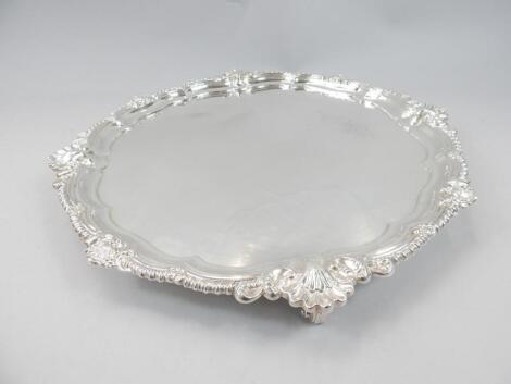 An Edwardian silver salver of scalloped edge outline