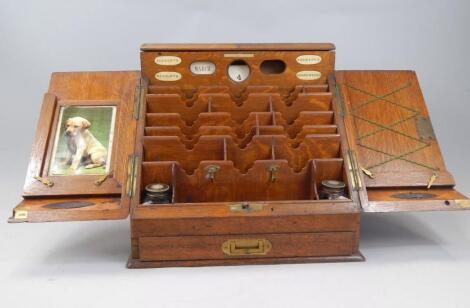 An Edwardian oak stationary cabinet