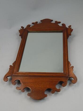 A mahogany fret frame wall mirror