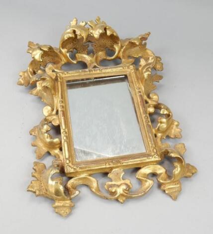 A Florentine gilt wood wall mirror