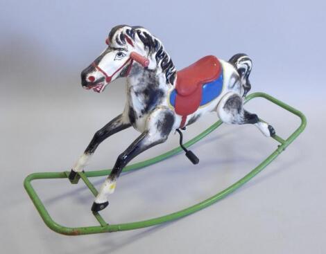 A mid 20thC metal rocking horse