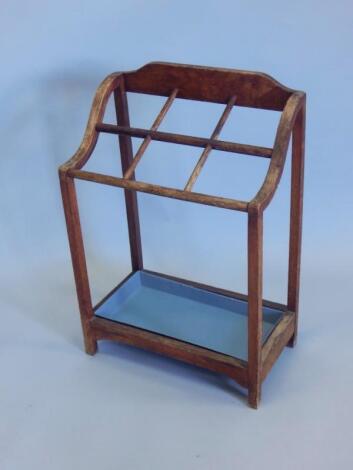 A 1920's oak six division umbrella stand