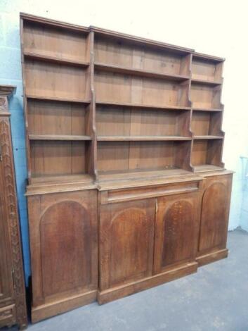 A Victorian oak breakfront bookcase