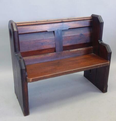 A late 19thC / early 20thC panelled pine small pew