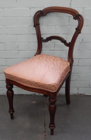 A Victorian rosewood balloon back chair