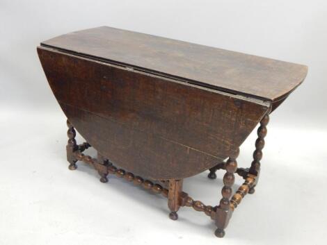 An 18thC oak oval gateleg table