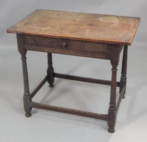 An oak and fruitwood side table