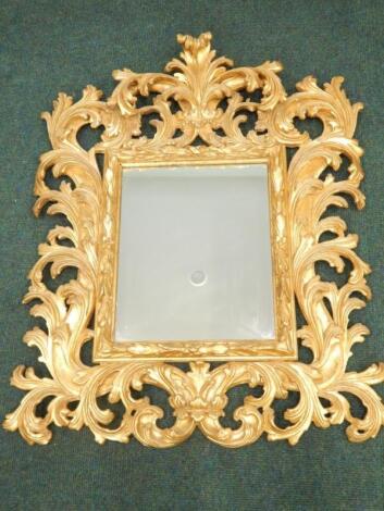 A Continental giltwood Florentine type wall mirror