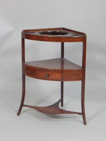 An early 19thC mahogany and ebony strung corner washstand