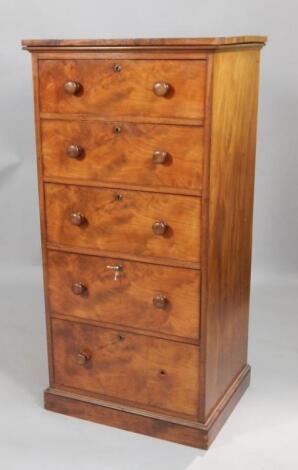 An early Victorian figured mahogany narrow chest of drawers
