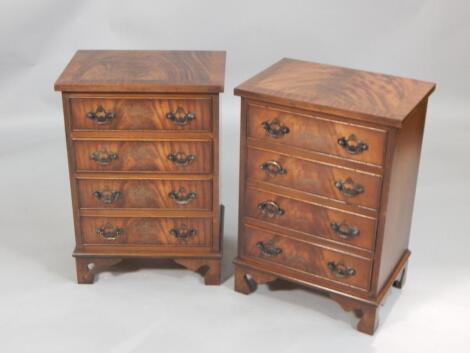 A pair of reproduction mahogany bedside chests