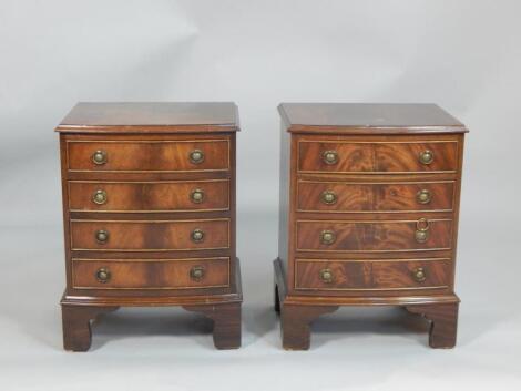 A pair of reproduction mahogany bedside chests