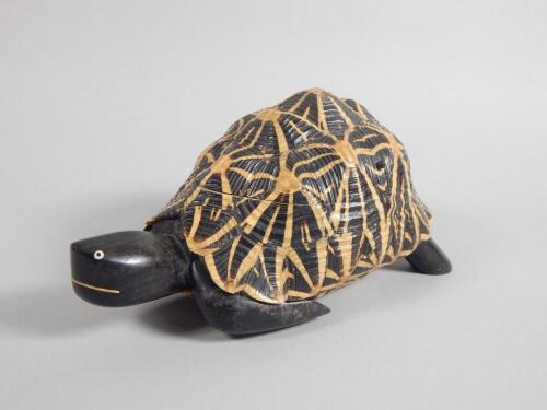 A carved ebony tortoise shaped jewellery box