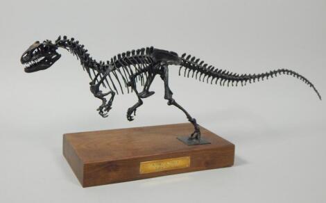 A metal scale model of an Allosaurus