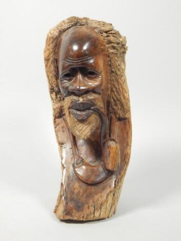 Tribal Art. African carving in the form of an old man smoking a pipe