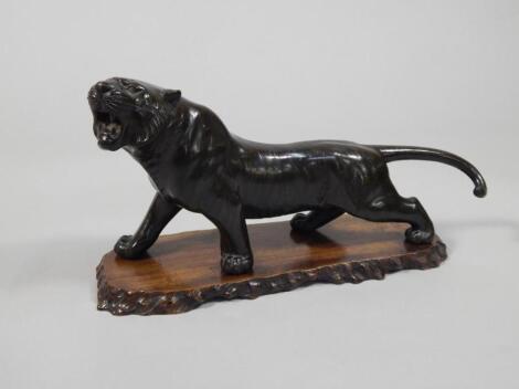 A Meiji period bronze figure of a lion