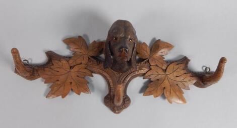 A late 19thC/early 20thC Black Forest linden wood coat rack