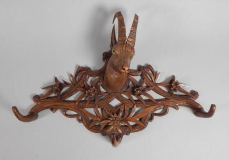 A late 19thC Black Forest linden wood coat hook