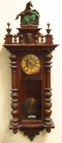 A late 19thC walnut cased Vienna wall clock