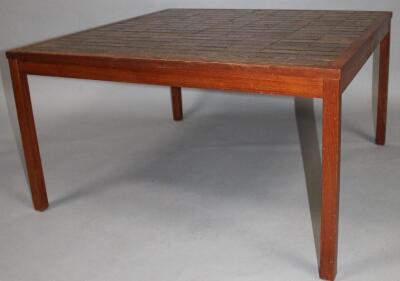 A retro teak framed coffee table