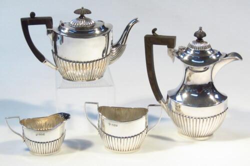 A Victorian silver three piece bachelor's tea service