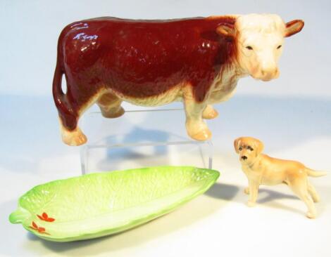 A 20thC pottery figure of a standing Hereford bull