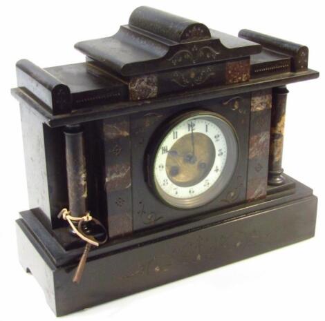 A Victorian black slate mantel clock