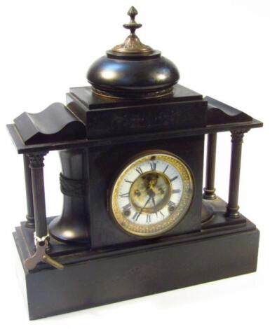 A Victorian black slate mantel clock