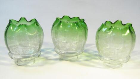 A set of three early 20thC etched clear and green glass shades