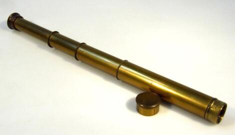 An early 20thC James Coppock Ltd brass four draw telescope, of plain cylindrical tapering outline with articulated top and lens, marks to one end, (when closed) 17cm high.