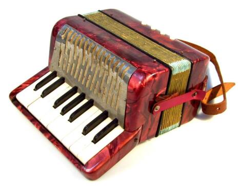 A child's Hohner miniature piano accordion