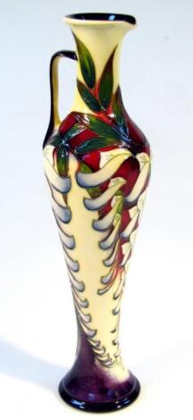 A Moorcroft pottery Cinensis pattern ewer by Phillip Gibson