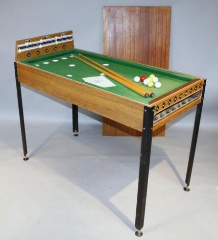 A retro teak bar billiards game