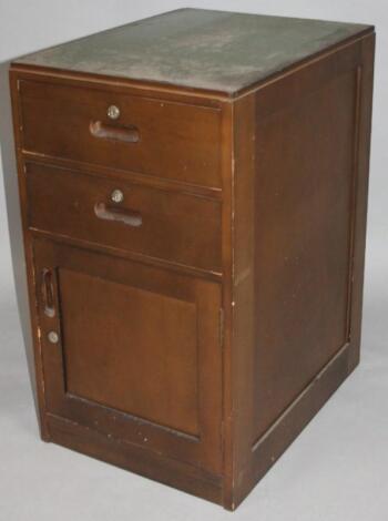 An early 20thC stained wooden filing cabinet