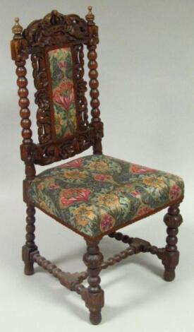 A late 19thC oak Carolean style high back chair