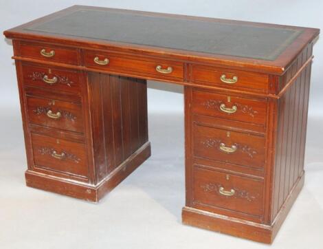 A late 19thC stained oak and walnut pedestal writing desk