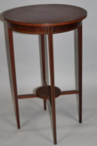 An Edwardian mahogany occasional table