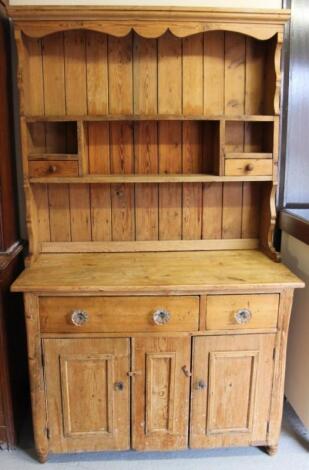 A 19thC stripped pine kitchen dresser