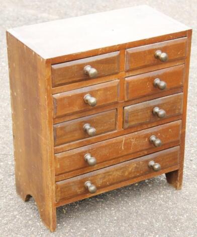 An early 20thC stained mahogany miniature chest