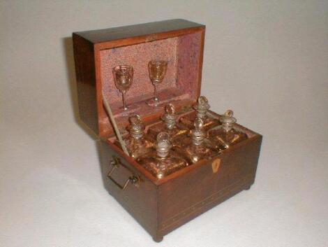 A 19thC flamed mahogany travelling decanter box