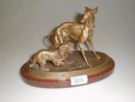 After P.J. Mene. A gilt brass figural group of a greyhound and