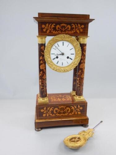 A 19thC French rosewood marquetry Portico type mantel clock