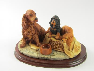 A Border Fine Arts sculpture modelled as Cocker Spaniel and pups