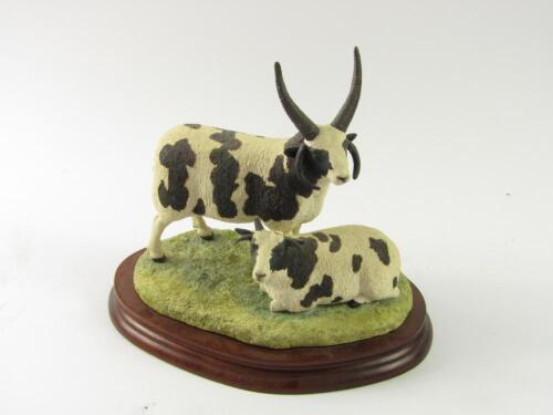A Border Fine Arts sculpture modelled as a pair of Jacob sheep