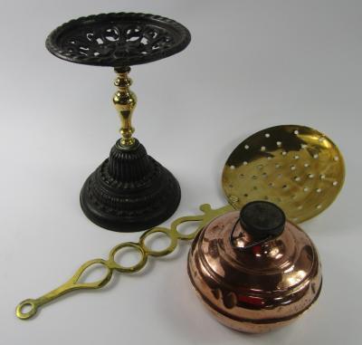 A cast iron and brass jardiniere stand