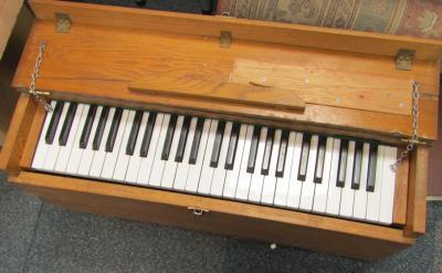 An oak cased travelling organ by A F Stevens Ltd