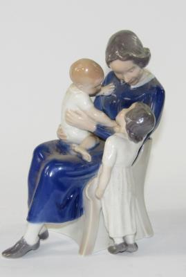 A Royal Copenhagen figure group of a mother