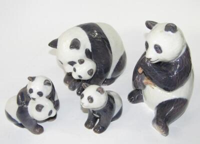 Four Royal Copenhagen models of panda bears and cubs