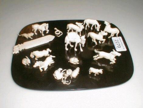 A group of miniature carved ivory figures of animals £50-80